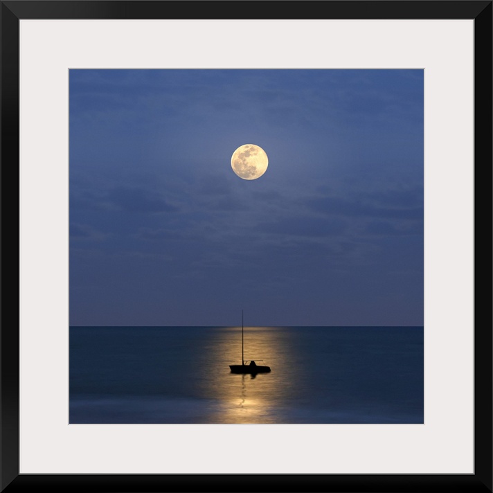 Silhouette sailboat with moon