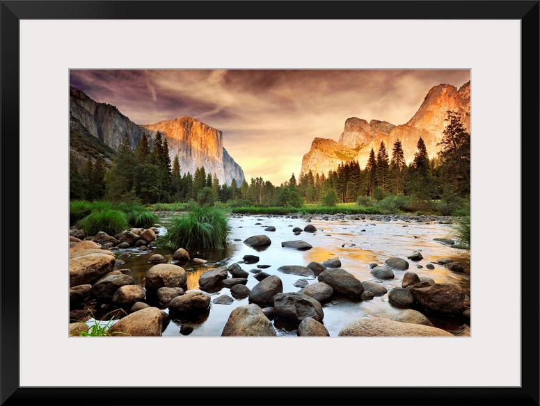 A landscape photograph taken from the valley floor of this national park as the sun illuminates the famous rock faces of t...