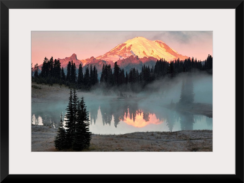 Fine art photo of sunlight hitting the snow peak of Mount Rainier, Washington.