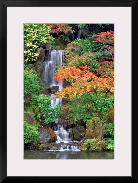 Photograph of waterfall surrounded by autumn trees.