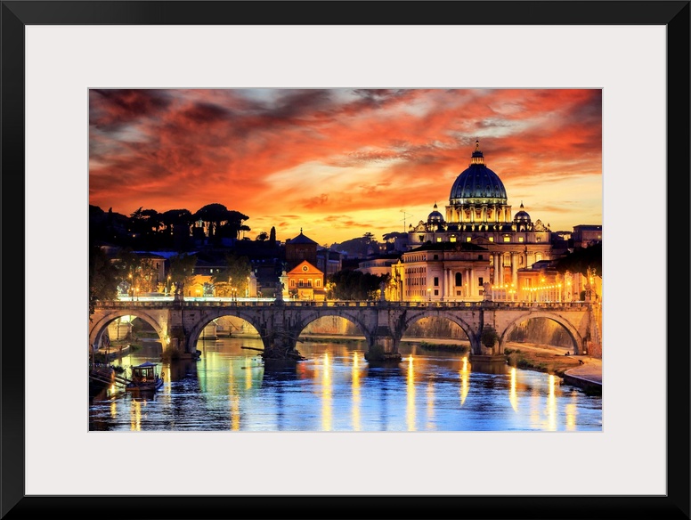 Italy, Rome, St. Peter Basilica by night reflecting on Tevere river