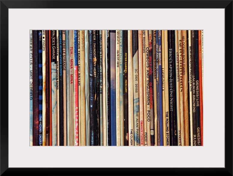 Big photograph shows a large collection of LP vinyl records that includes works from artists such as Eric Clapton, Billy J...