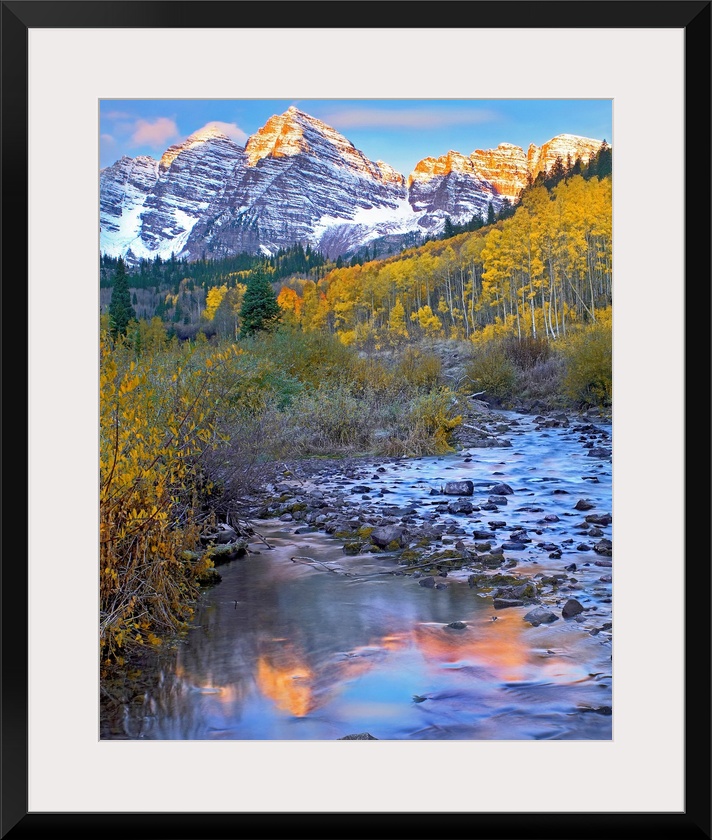 Vertical wall art photograph of a rock filled stream running through an aspen tree filled meadow in the Rocky Mountains.