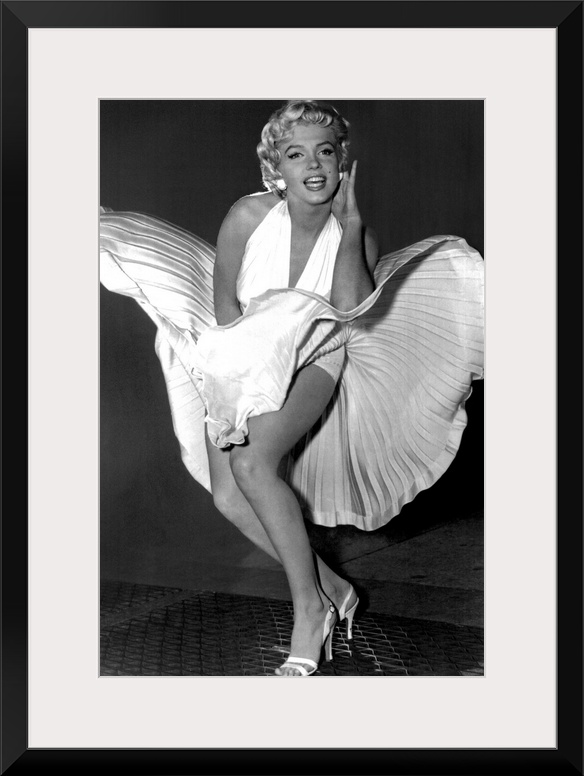 A vertical photograph of the actress in her white dress and high heels standing over a subway grate causing her skirt to b...