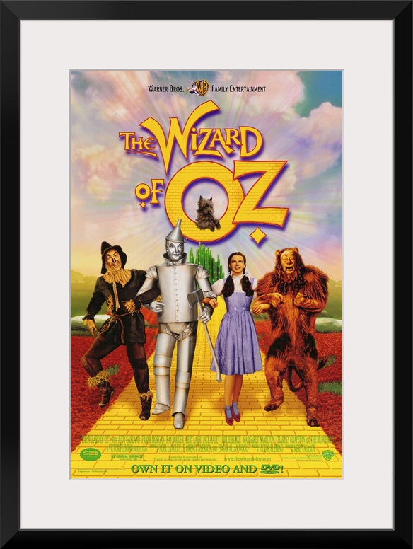 Wall art of a classic movie with the Scarecrow, Tin man, Dorothy and the Cowardly Lion walking down the yellow brick road.