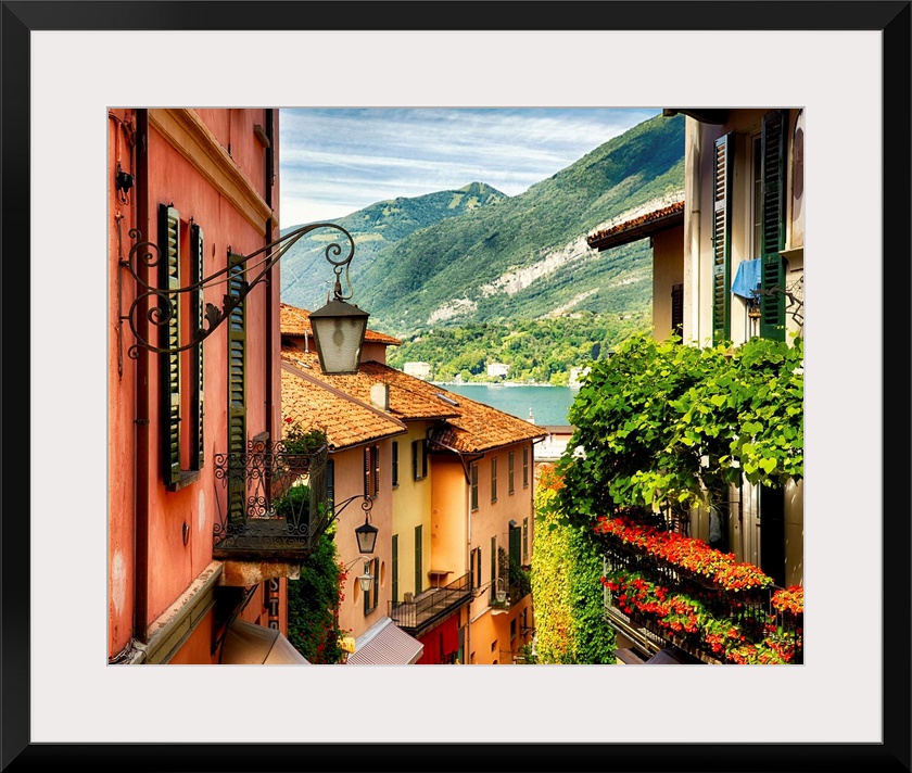 Fine art photo of the roofs of shops in a European city, looking to the lake below.