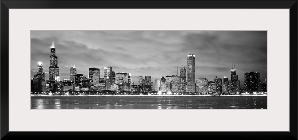 Black and White panoramic photograph showing the view from Lake Michigan in winter of the Chicago skyline of the downtown ...