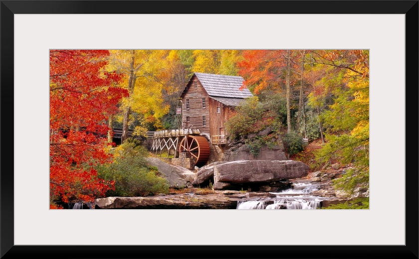 Panoramic photograph of the Glade Creek Grist Mill located within Babcock State Park in West Virginia.  The waterfall in t...