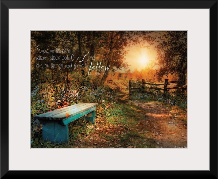 A small bench in the woods near a fence at sunset, with a bible verse.