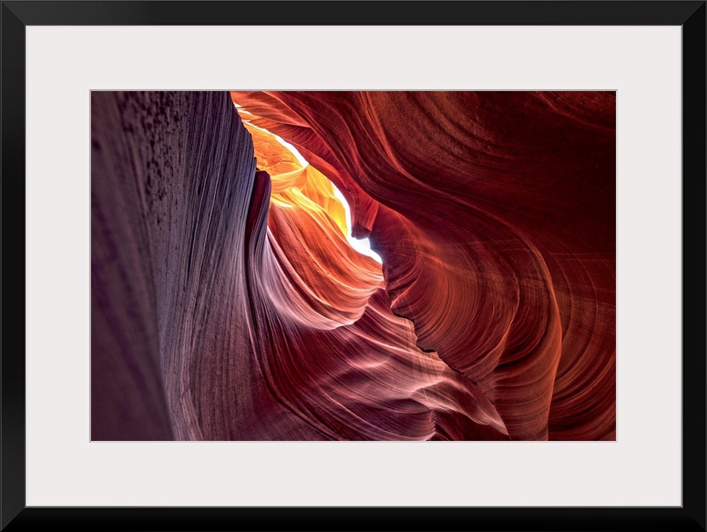 Photograph from inside of Antelope Canyon rock formation located on the Navajo Reservation in Page, Arizona with colorful ...