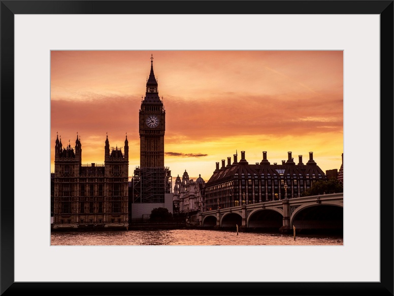 View of Big Ben and Westminster Bridge at sunset in London, England.