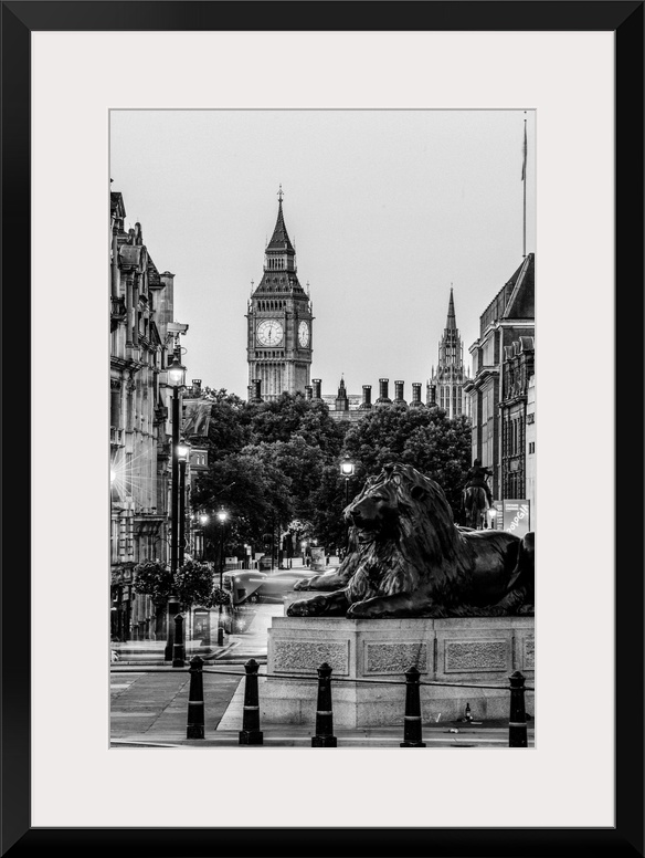 Black and white photograph of Trafalgar Square with the iconic Trafalgar Lions in the foreground and Big Ben in the backgr...