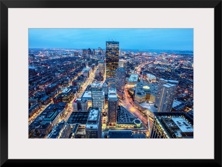 Photo of Boston cityscape at night featuring the John Hancock Tower.