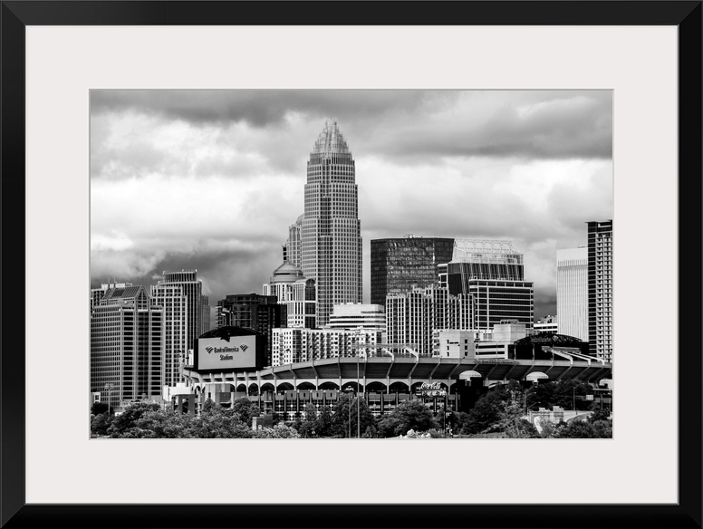 Horizontal image of the city of Charlotte, North Carolina with a cloudy sky.