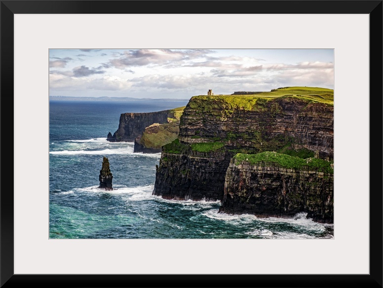 Photograph of the Cliffs of Moher with O'Brien's Tower seen in the distance, marking the highest point of the Cliffs of Mo...