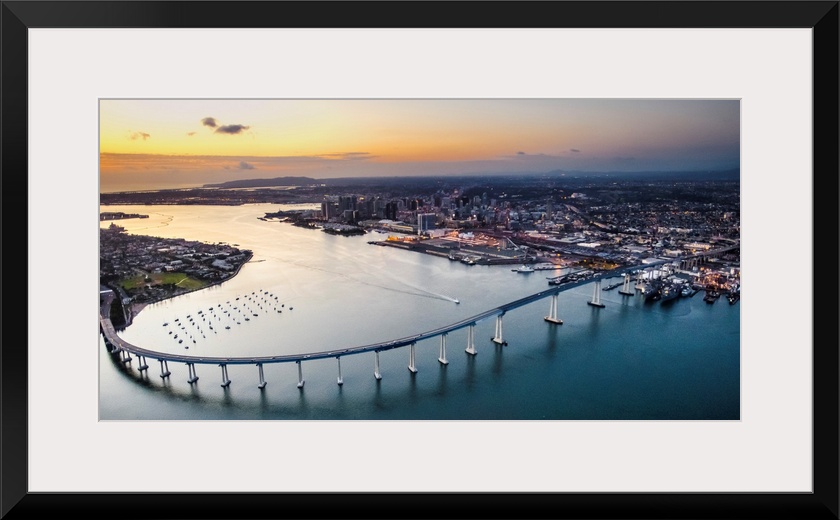 Aerial view of the Coronado Bridge in San Diego, California, at sunset.