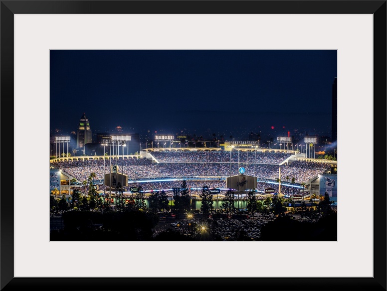Photograph of Dodger Stadium lit up on a game night.