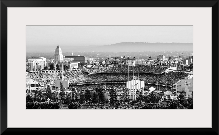 Panoramic photograph of Dodger Stadium lit up on a game night.