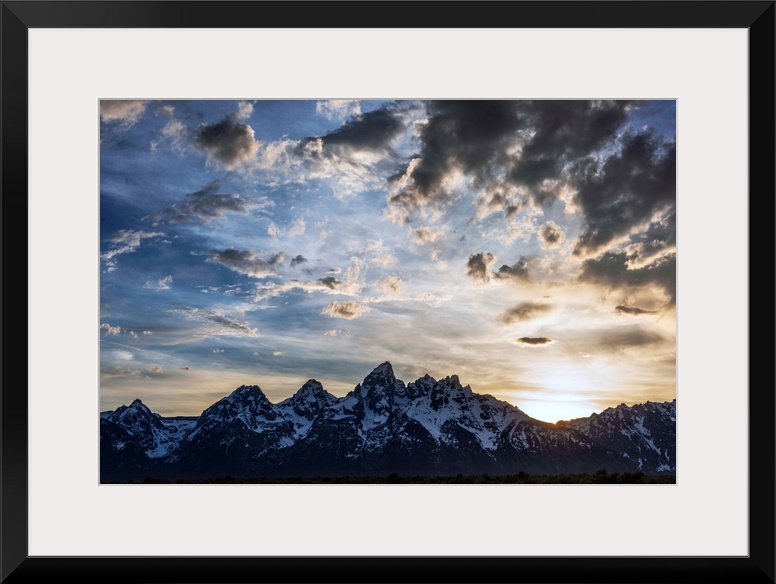 View of dramatic clouds over Teton mountains in Wyoming.