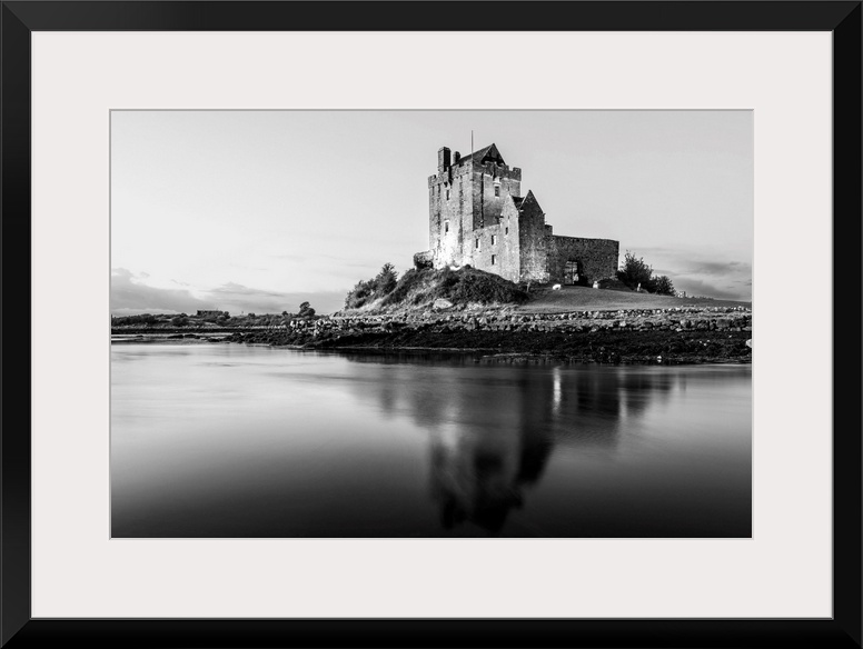 Black and White landscape photograph of the Dunguaire Castle reflecting into the water on the southeastern shore of Galway...