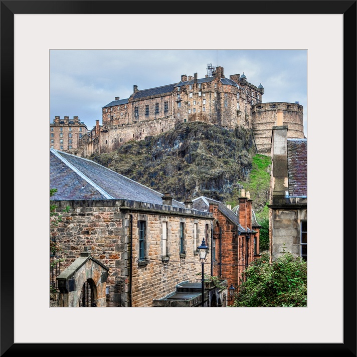 Square photograph of the Edinburgh Castle with old stone buildings in the foreground, Edinburgh, Scotland, UK