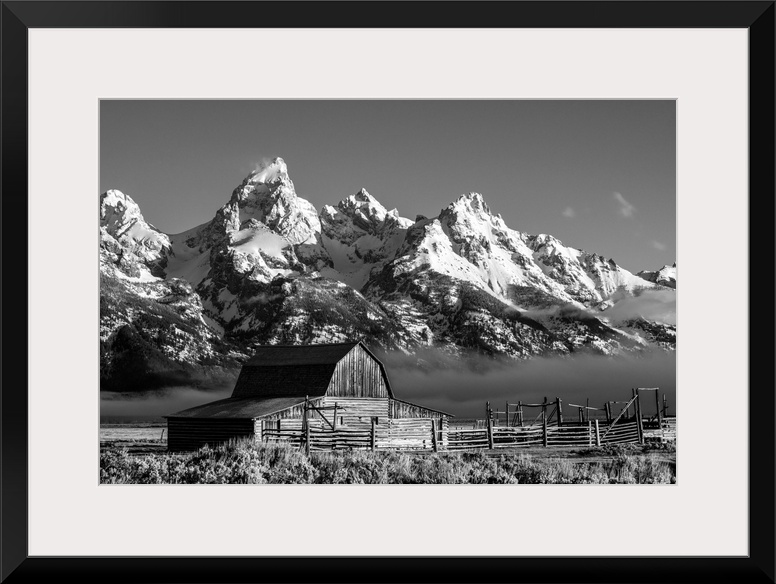 The John Moulton barn sits against a picturesque landscape of the Teton mountain range in Wyoming.