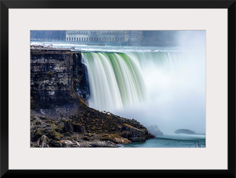 View of Horseshoe Falls at Niagara Falls with former Toronto power generating station in the background.