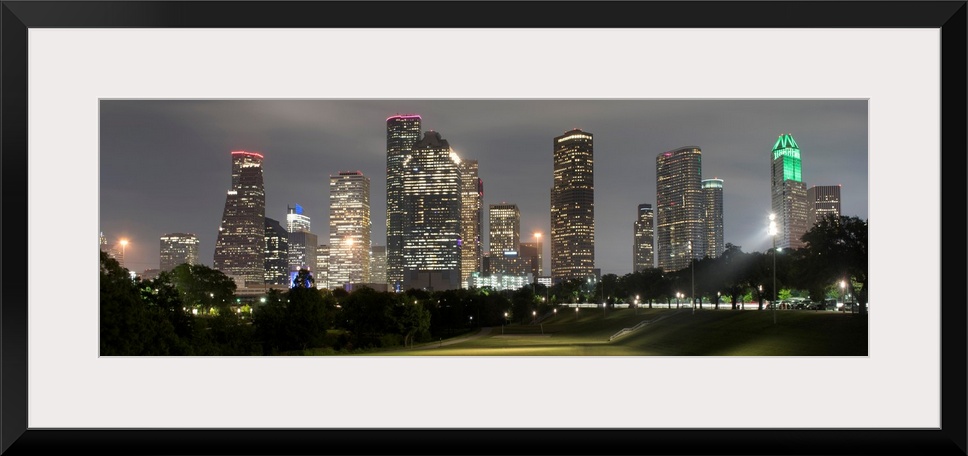 Panoramic photograph of the Houston TX skyline at night from Eleanor Tinsley Park.