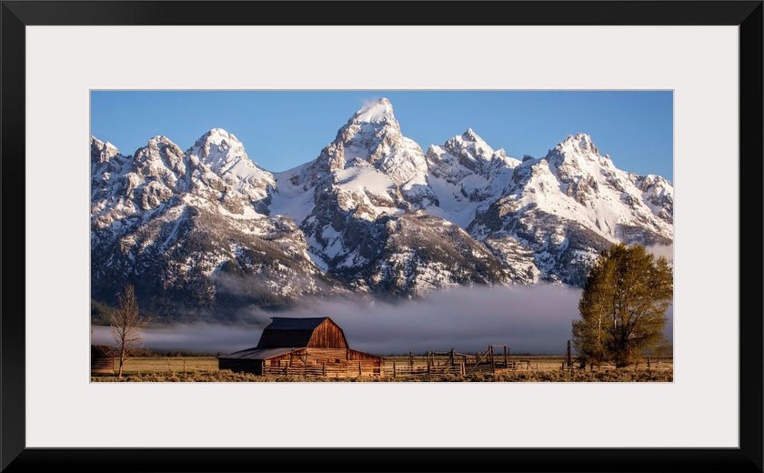 View of the John Moulton Barn with Middle Teton, Grand Teton and Mount Owen in the background. Grand Teton National Park, ...