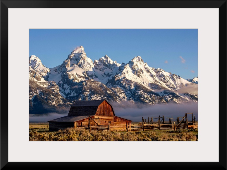 View of the John Moulton Barn with Middle Teton, Grand Teton and Mount Owen in the background. Grand Teton National Park, ...