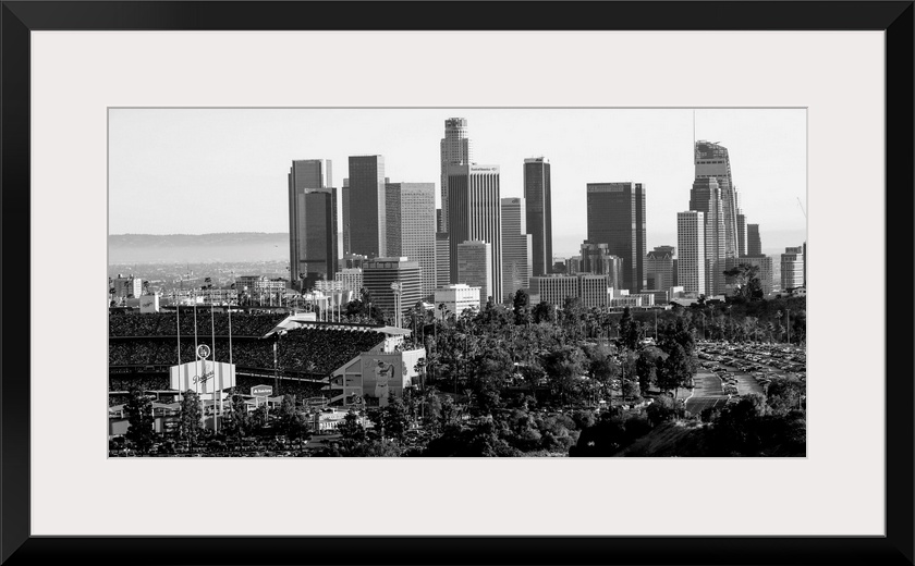 Photograph of the downtown Los Angeles skyline with Dodger Stadium on the left.