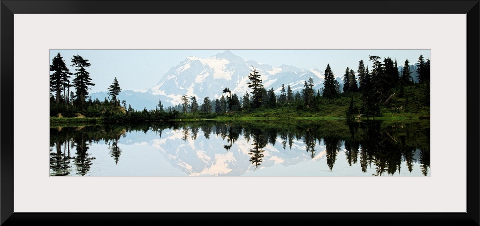 Panoramic photograph of Mt. Shuksan reflecting into Picture Lake around sunset.