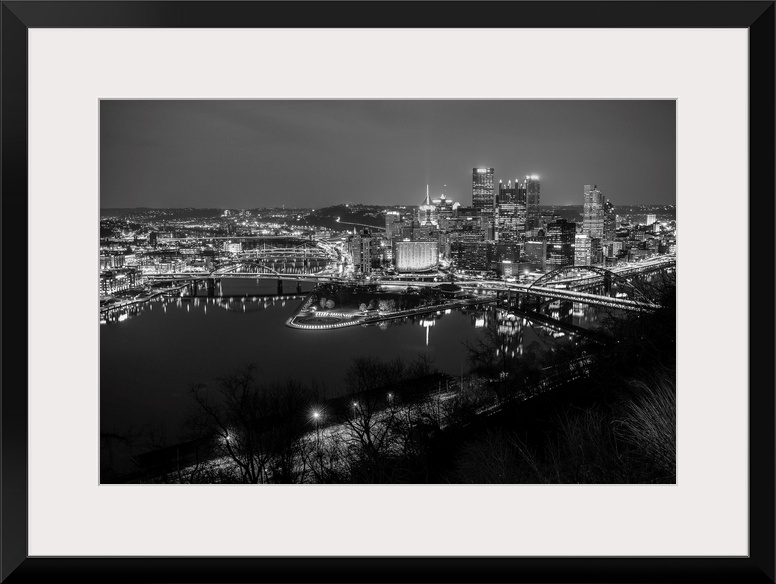Photo of downtown Pittsburgh at night with Point State park.