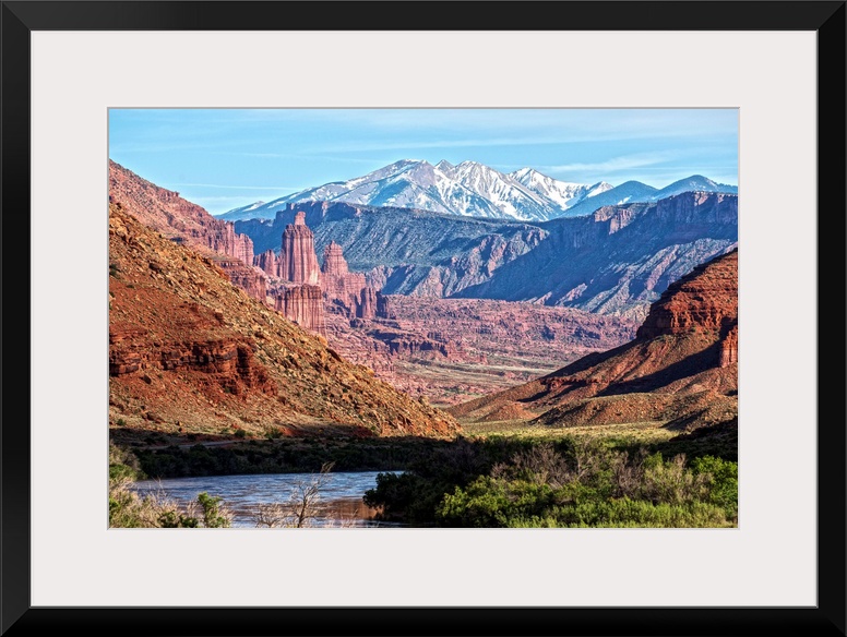 A river running through the Salt Valley of Arches National Park, with a view of the Fiery Furnace and the La Sal Mountains...