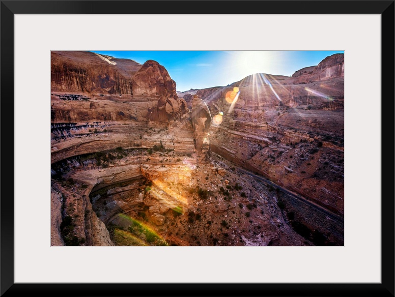 The sun shining on Shafer Canyon, Canyonlands National Park, Utah