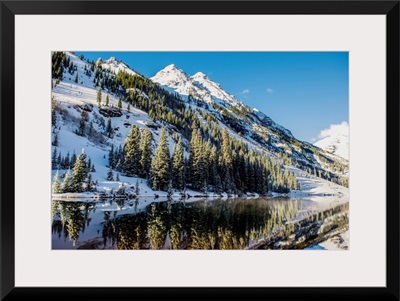 Snowy mountainside surrounding Maroon Lake in the Maroon Bells, Aspen, Colorado