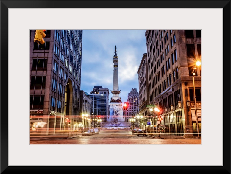 The Soldiers and Sailors Monument in the evening with lights from passing traffic in Indianapolis, Indiana.