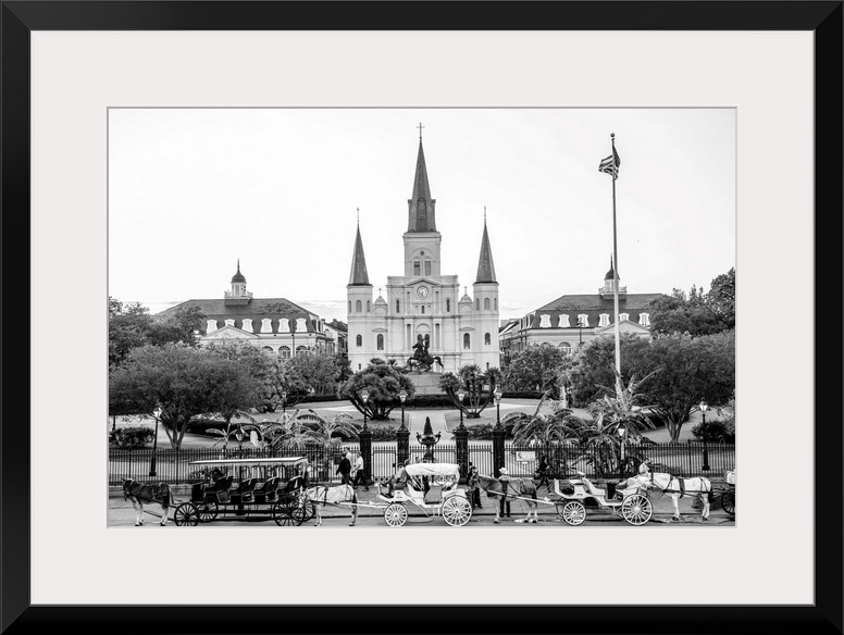 View of carriages stand in front of St. Louis Cathedral and Jackson Square in New Orleans, Louisiana.