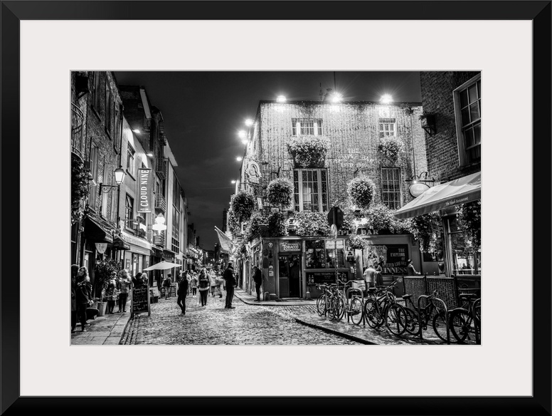 Photograph of Temple Bar, a busy riverside neighborhood in Dublin, Ireland, at night.