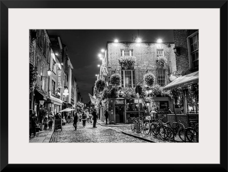 Photograph of Temple Bar, a busy riverside neighborhood in Dublin, Ireland, at night.