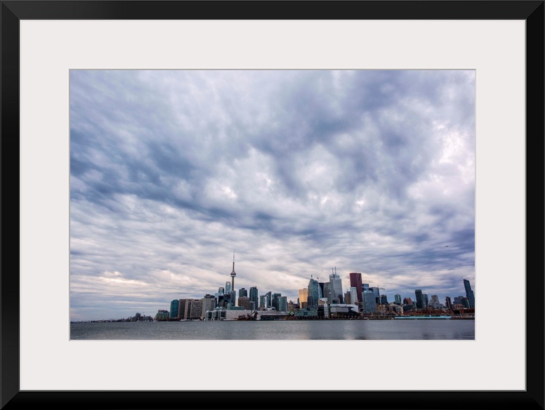 Toronto city skyline under dramatic clouds, Ontario, Canada.