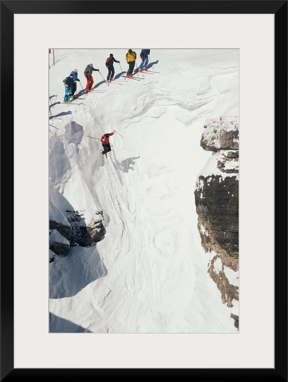 Skilled skiers plunge more than 15 feet in Corbet's Couloir.