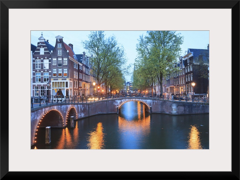 Keizersgracht and Leidsegracht canals at dusk, Amsterdam, Netherlands, Europe.