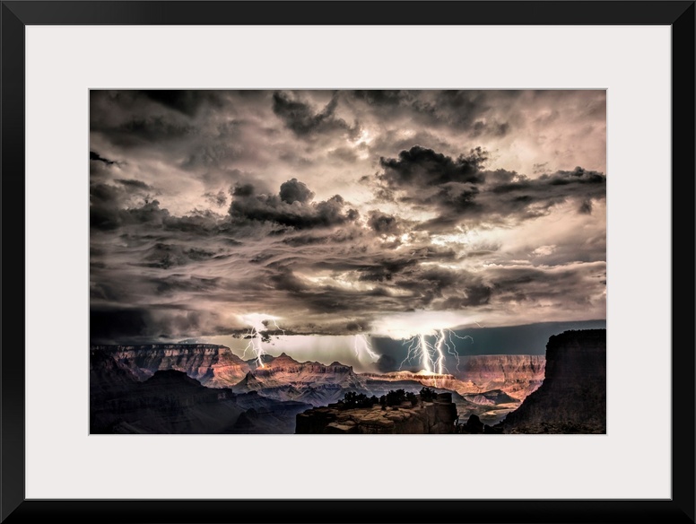 Photograph of lightning bolts striking gorge after sunset during a thunderstorm.