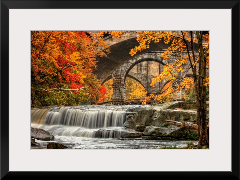 Berea Falls, Ohio, during peak fall colors. This cascading waterfall looks it's best with peak autumn colors in the trees....