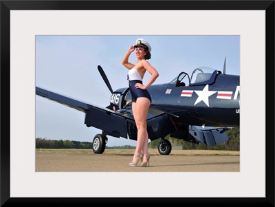 1940's style Navy pin-up girl posing with a vintage Corsair aircraft