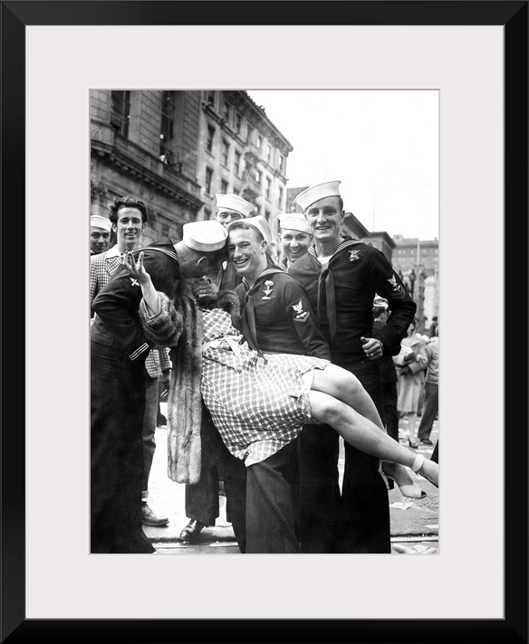 American sailors kissing and posing with a woman while celebrating the end of World War II, possibly in Times Square, New ...