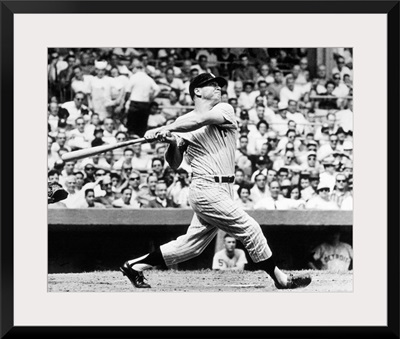 Mickey Mantle of the New York Yankees, hitting his 49th home run of the season