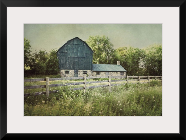 A photograph of a blue barn.