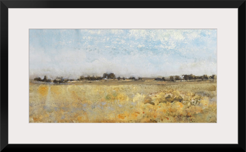 A beautiful pastoral panoramic landscape of golden autumn fields under a blue sky